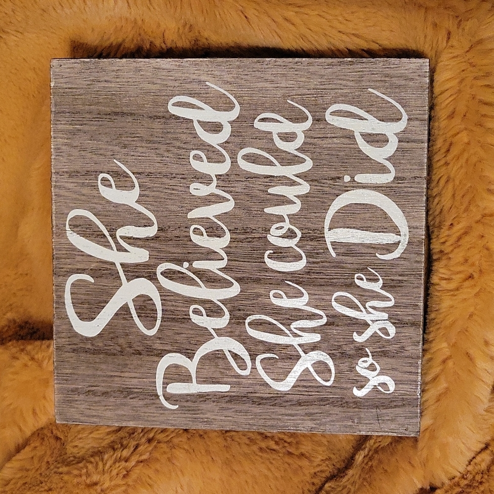 "She believed" sign